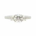 Solitaire en Or Blanc, Diamant Rond et diamants baguettes